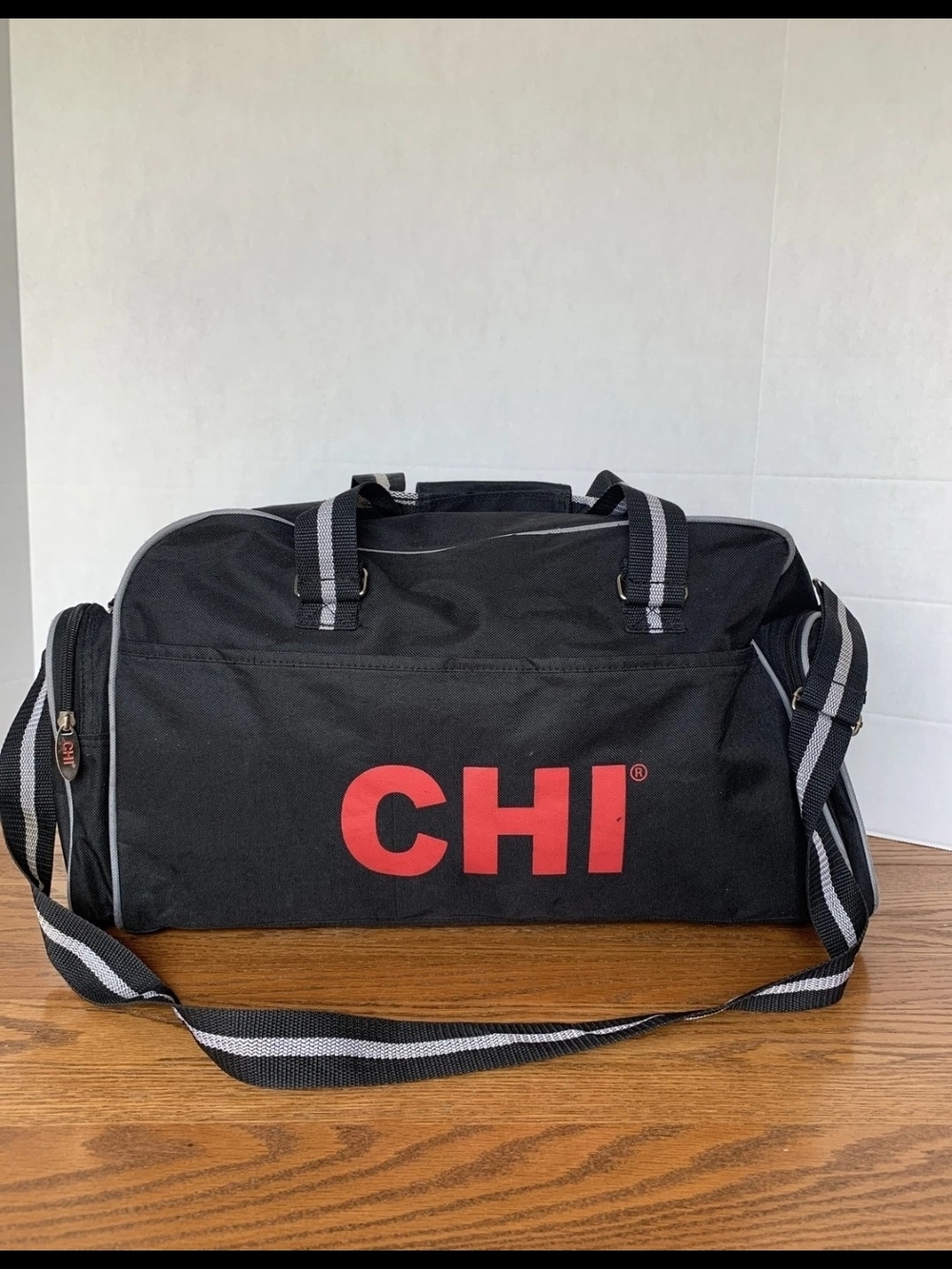 Black Canvas Duffel Bag with Red Logo Accent